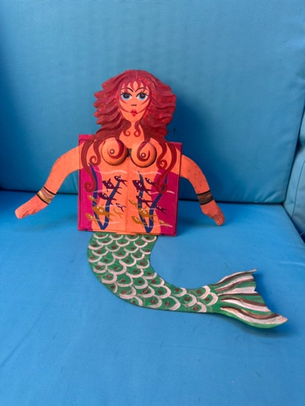 Redheaded painted tin mermaid with chest drawers that open to a mirror.